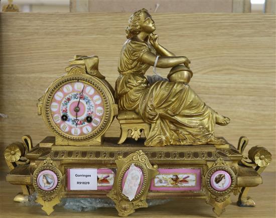 A late 19th century French eight day gilt spelter eight day mantel clock, inset Sevres style porcelain plaques height 30cm